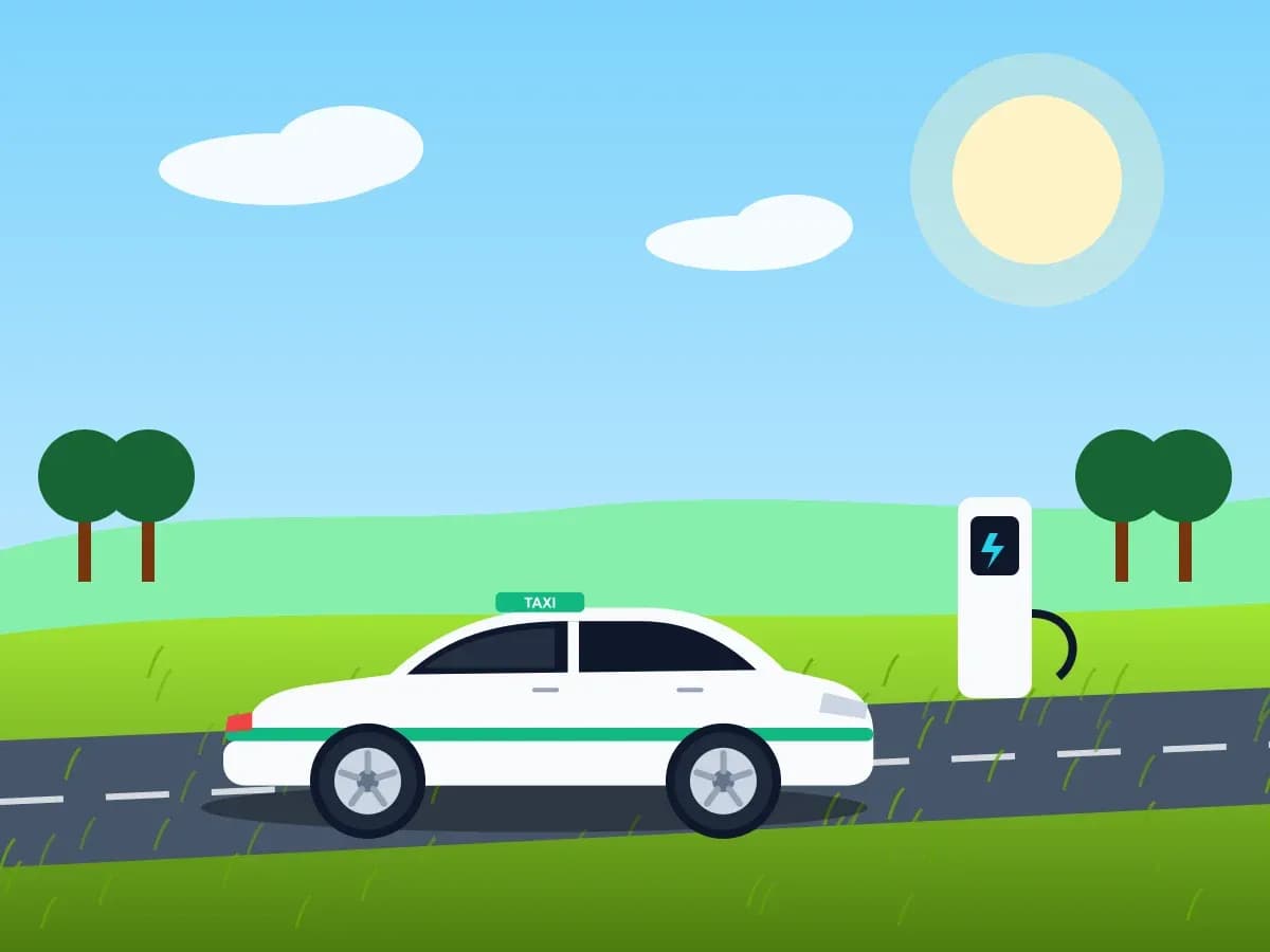 Taxi điện dừng bên trạm sạc giữa cánh đồng Nam Định